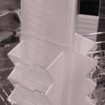 Clear rotating display stand with card slots.